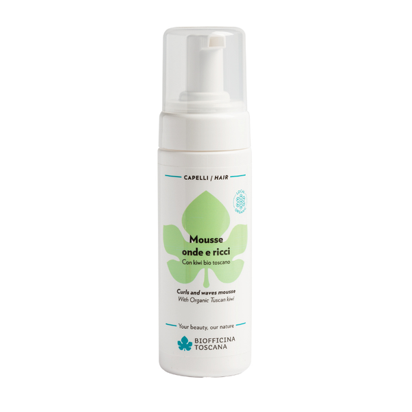 A white pump bottle of Biofficina Toscana Curl and Wave Mousse for hair, featuring a green leaf logo and black and blue text on a clean white background. Lightweight styling mousse for bouncier, more defined curls and waves, even in humidity.