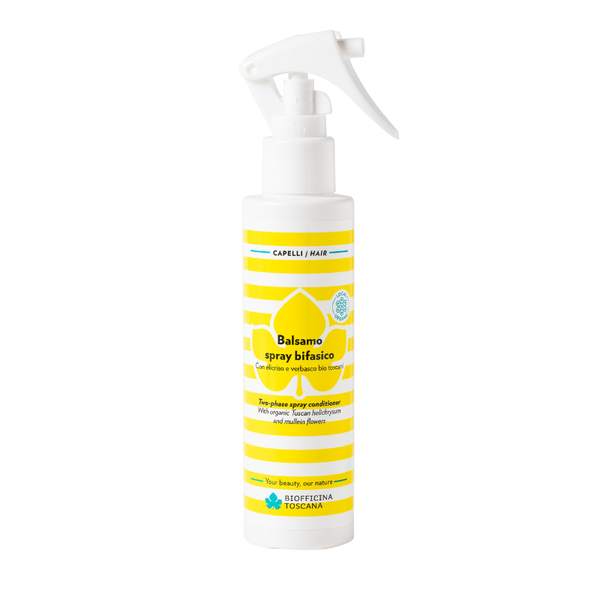 A white plastic trigger spray bottle of Bicasano Balsamo spray bifasico hair and body conditioner with a yellow and white striped label. Leave-in, two-phase detangling spray for hair exposed to sun, salt, and chlorine.
