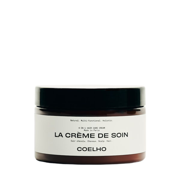 A jar of Coelho La Crème de Soin hair care cream with a black lid and white label, set against a plain white background.