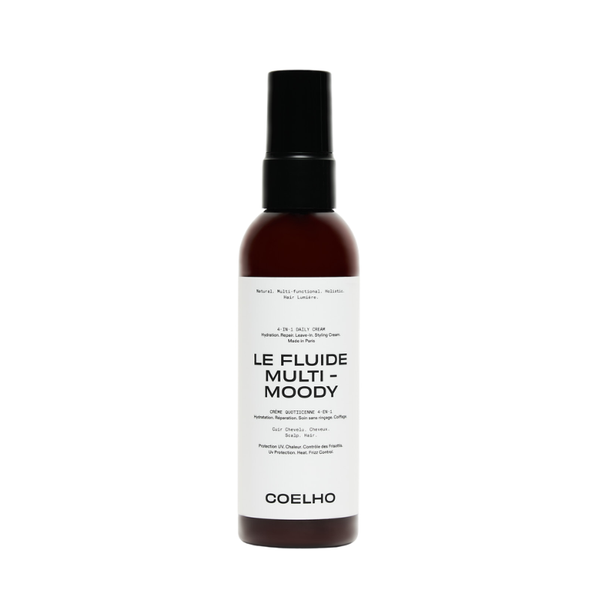 A bottle of COELHO Le Fluide Multi-Moody hair product, featuring a dark amber brown bottle, a black spray nozzle, and a clean white label with black text, set against a plain white background.