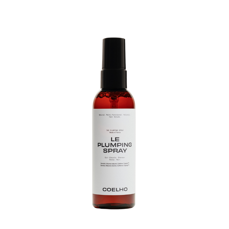 A bottle of COELHO Le Plumping Spray with a black spray nozzle and a white label, set against a plain white background.