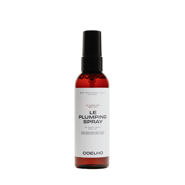 A bottle of COELHO Le Plumping Spray with a black spray nozzle and a white label, set against a plain white background.