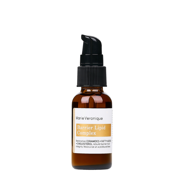 A bottle of Marie Veronique Barrier Lipid Complex on a solid white background. The product is in an amber glass bottle with a black pump dispenser and a white label featuring a gold accent block. Profoundly moisturizing, restorative oil-cream hybrid with ceramides, fatty acids, and cholesterol.