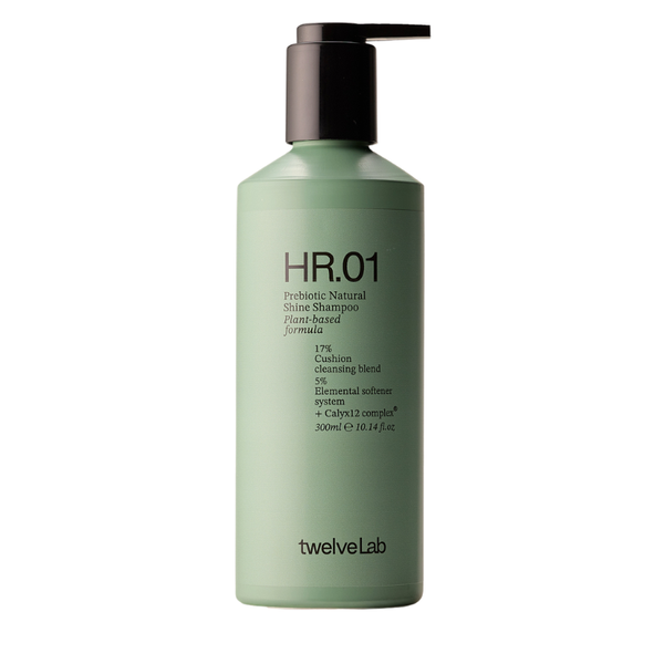 A 500ml bottle of twelveLab HR.01 Probiotic Natural Shine Shampoo, featuring a light sage green bottle and a dark brown pump dispenser, set against a plain white background.